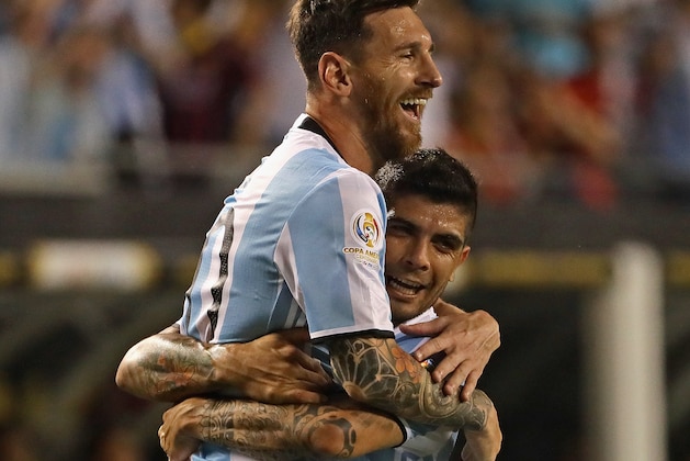 CHICAGO, IL - JUNE 10:  Lionel Messi #10 of Argentina is lifted into the air by teammate Ever Banega #19 after scoring a goal on a penalty kick against Panama during a match in the 2016 Copa America Centenario at Soldier Field on June 10, 2016 in Chicago, Illinois. Argentina defeated Panama 5-0.  (Photo by Jonathan Daniel/Getty Images)