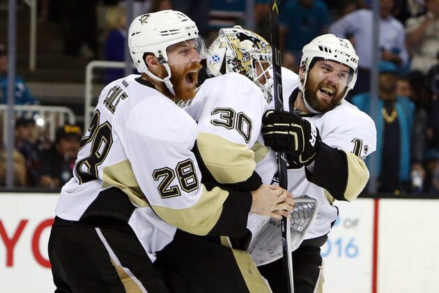 Jun 12, 2016; San Jose, CA, USA; Pittsburgh Penguins goalie Matt Murray (30) celebrates with defenseman Ben Lovejoy (12) and defenseman Ian Cole (28) after defeating the San Jose Sharks in game six of the 2016 Stanley Cup Final at SAP Center at San Jose. Mandatory Credit: Jerry Lai-USA TODAY Sports