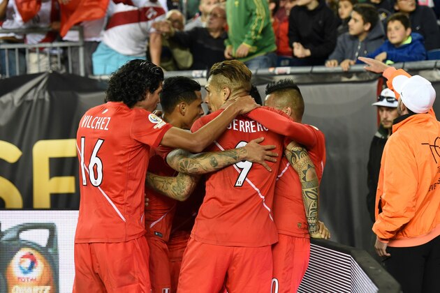Peru's players celebrate after teammate Raul Ruidiaz (covered) scored against Brazil during their Copa America Centenario football tournament match in Foxborough, Massachusetts, United States, on June 12, 2016.  / AFP / Timothy A. CLARY        (Photo credit should read TIMOTHY A. CLARY/AFP/Getty Images)