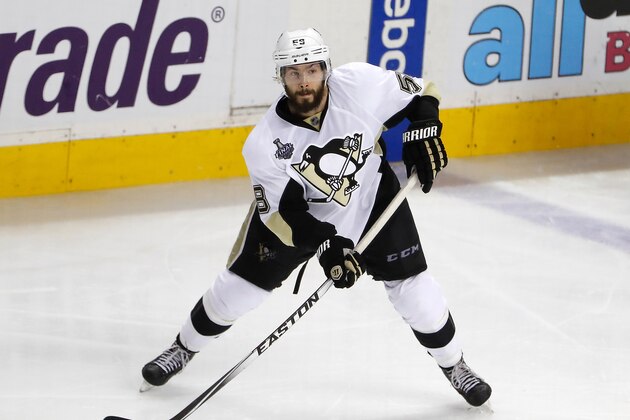 SAN JOSE, CA - JUNE 12: Kris Letang #58 of the Pittsburgh Penguins looks to move the puck against the San Jose Sharks during the third period in Game Six of the 2016 NHL Stanley Cup Final at SAP Center on June 12, 2016 in San Jose, California. The Pittsburgh Penguins defeat the San Jose Sharks 3-1. (Photo by Christian Petersen/Getty Images)
