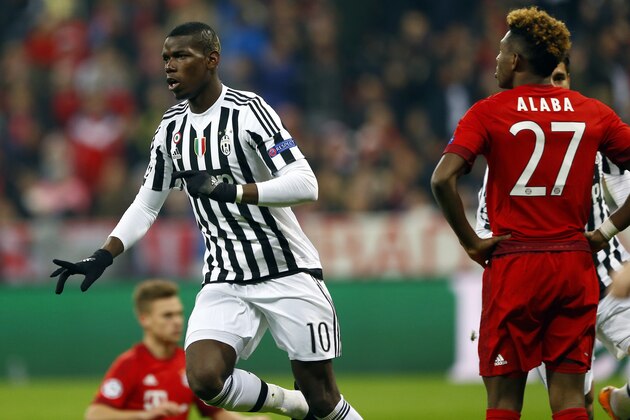 Juventus' Paul Pogba, front left, celebrates after scoring the opening goal during the Champions League round of 16 second leg soccer match between FC Bayern Munich and Juventus Turin in Munich, southern Germany, Wednesday, March 16, 2016. At right is Bayern's David Alaba. (AP Photo/Matthias Schrader)