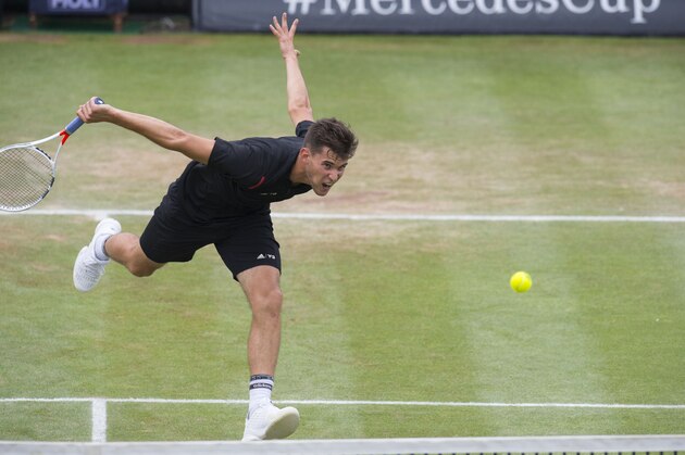 Austria's Dominic Thiem returns the ball to Germany's Philipp Kohlschreiber in the final match at the ATP Cup tennis tournament in Stuttgart, southwestern Germany, on June 12, 2016.   / AFP / THOMAS KIENZLE        (Photo credit should read THOMAS KIENZLE/AFP/Getty Images)