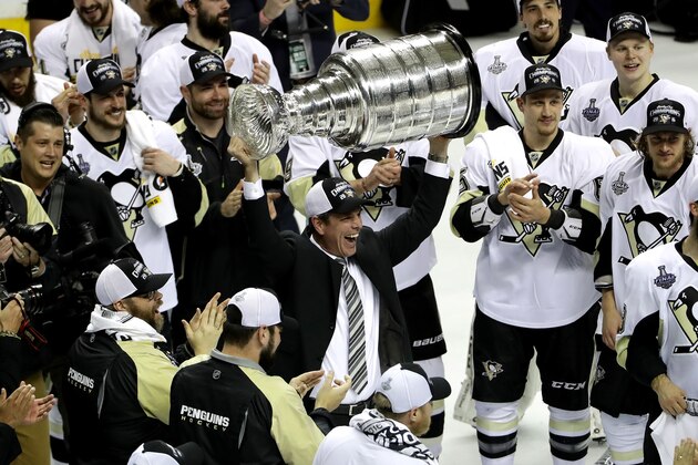 SAN JOSE, CA - JUNE 12:  Mike Sullivan of the Pittsburgh Penguins celebrates with the Stanley Cup after their 3-1 victory to win the Stanley Cup against the San Jose Sharks in Game Six of the 2016 NHL Stanley Cup Final at SAP Center on June 12, 2016 in San Jose, California.  (Photo by Ezra Shaw/Getty Images)