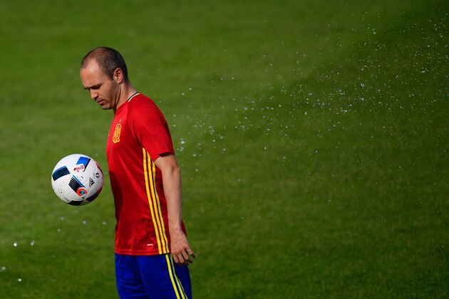 Spain's midfielder Andres Iniesta controls the ball during a training session in Saint Martin de Re's stadium on June 9, 2016, on the eve of the start of the Euro 2016 football tournament. / AFP / PIERRE-PHILIPPE MARCOU        (Photo credit should read PIERRE-PHILIPPE MARCOU/AFP/Getty Images)