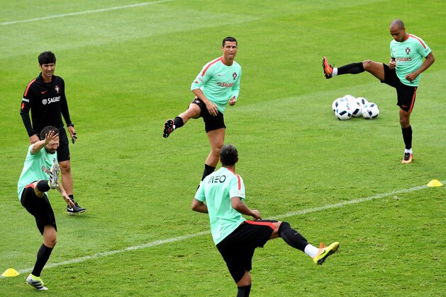 Portugal's forward Cristiano Ronaldo (C TOP) and teammates ake part in a training session at the Portugal's base camp in Marcoussis, outskirts of Paris, on June 12, 2016, during the UEFA Euro 2016 football tournament. / AFP / FRANCISCO LEONG        (Photo credit should read FRANCISCO LEONG/AFP/Getty Images)