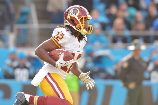 CHARLOTTE, NC - NOVEMBER 22:  Andre Roberts #12 of the Washington Redskins returns a kickoff for a touchdown against the Carolina Panthers during their game at Bank of America Stadium on November 22, 2015 in Charlotte, North Carolina.  (Photo by Grant Halverson/Getty Images)