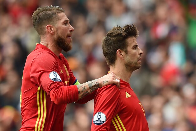 Spain's defender Gerard Pique celebrates with Spain's defender Sergio Ramos after scoring the opening goal during the Euro 2016 group D football match between Spain and Czech Republic at the Stadium Municipal in Toulouse on June 13, 2016.
Spain won the match 1-0. / AFP / NICOLAS TUCAT        (Photo credit should read NICOLAS TUCAT/AFP/Getty Images)