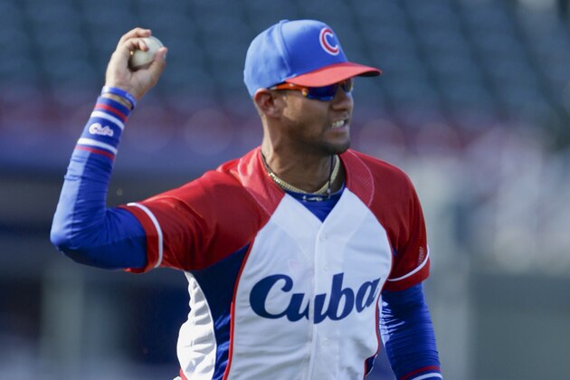 Cuba third baseman Yulieski Gourriel prior to an exhibition baseball game against the United States in Papillion, Neb., Friday, July 19, 2013. (AP Photo/Nati Harnik)