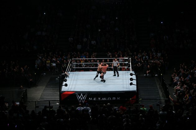 Wrestlers fight during a show at the AccorHotels Arena in Paris, as part of the WrestleMania Revenge Tour, the World Wrestling Entertainment (WWE) European tour, on April 22, 2016.  / AFP / THOMAS SAMSON        (Photo credit should read THOMAS SAMSON/AFP/Getty Images)