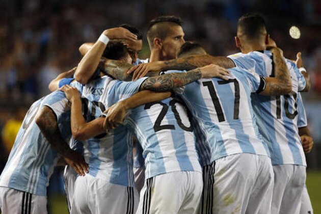 Argentina players celebrate after Lionel Messi scored a goal during a Copa America Centenario group D soccer match against Panama on Friday, June 10, 2016, in Chicago. (AP Photo/Charles Rex Arbogast)