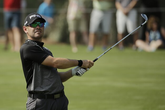 Louis Oosthuizen of South Africa, follows his shot from the 15th fairway during the second round of The Players Championship golf tournament Friday, May 13, 2016, in Ponte Vedra Beach, Fla. (AP Photo/Chris O'Meara)