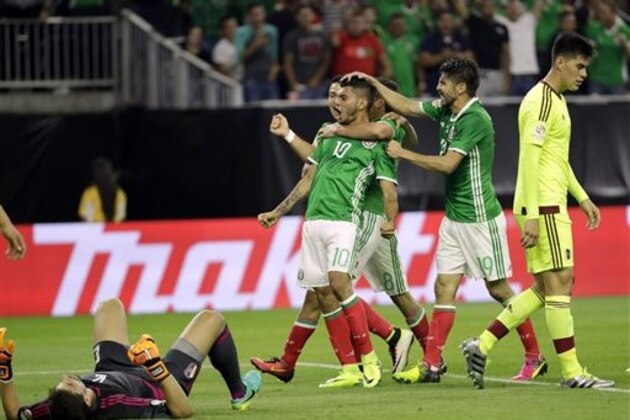 Mexico forward Jesus Manuel Corona (10) celebrates his goal against Venezuela with teammates during a Copa America Centenario group C soccer match Monday, June 13, 2016, in Houston. (AP Photo/David J. Phillip)