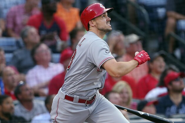 Cincinnati Reds' Adam Duvall watches his RBI sacrifice fly during the third inning of a baseball game against the Atlanta Braves on Monday, June 13, 2016, in Atlanta. (AP Photo/John Bazemore)