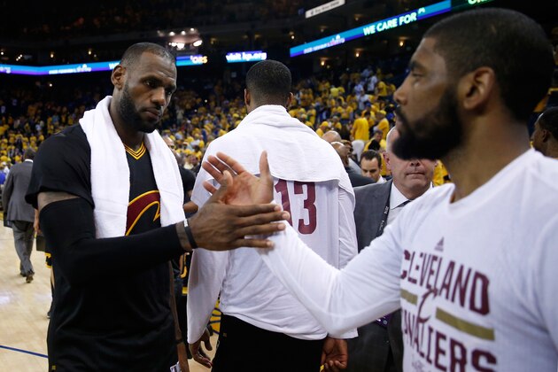 OAKLAND, CA - JUNE 13:  LeBron James #23 of the Cleveland Cavaliers celebrates with teammate Kyrie Irving #2 after defeating the Golden State Warriors in Game 5 of the 2016 NBA Finals with a score of 112 to 97 at ORACLE Arena on June 13, 2016 in Oakland, California. NOTE TO USER: User expressly acknowledges and agrees that, by downloading and or using this photograph, User is consenting to the terms and conditions of the Getty Images License Agreement.  (Photo by Ezra Shaw/Getty Images)