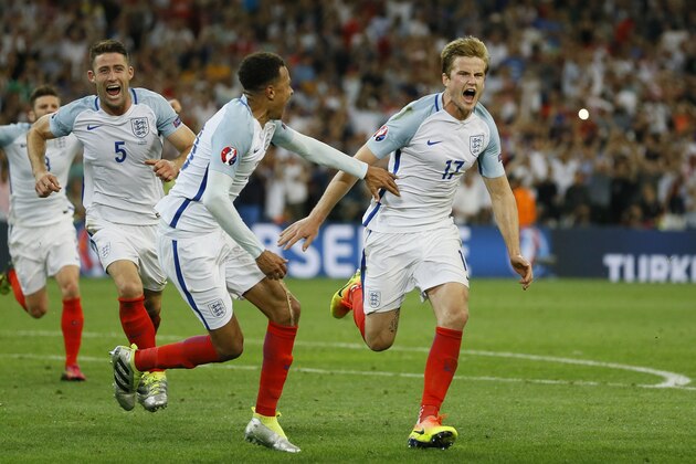 England's Eric Dier, right, celebrates after scoring the opening goal during the Euro 2016 Group B soccer match between England and Russia, at the Velodrome stadium in Marseille, France, Saturday, June 11, 2016. (AP Photo/Kirsty Wigglesworth)