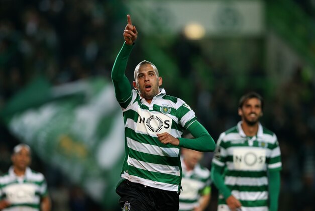 Sporting’s Islam Slimani, celebrates after scoring the opening goal  during a Portuguese league soccer match against Porto at the Alvalade stadium in Lisbon, Saturday, Jan. 2 2016. (AP Photo/Steven Governo)