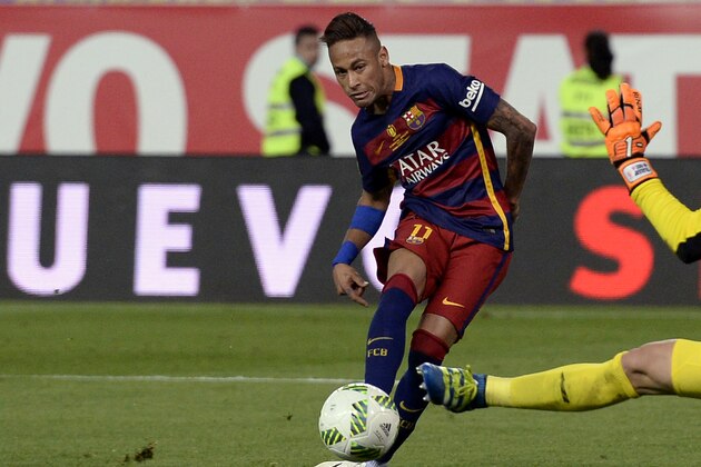 Barcelona's Brazilian forward Neymar (L) scores past Sevilla's goalkeeper Sergio Rico Gonzalez during the Spanish 'Copa del Rey' (King's Cup) final match FC Barcelona vs Sevilla FC at the Vicente Calderon stadium in Madrid on May 22, 2016. / AFP / JOSEP LAGO        (Photo credit should read JOSEP LAGO/AFP/Getty Images)