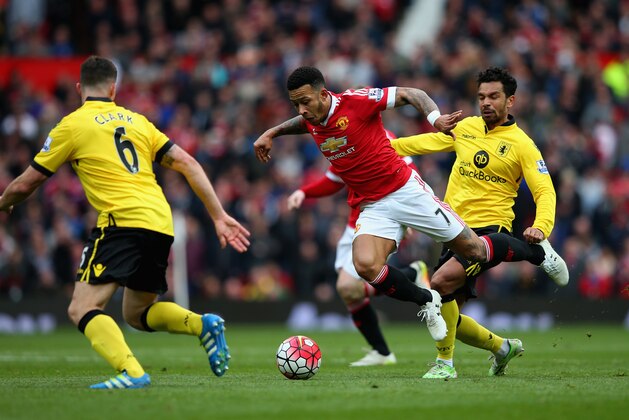 MANCHESTER, ENGLAND - APRIL 16:  Memphis Depay of Manchester United goes down under a challnge during the Barclays Premier League match between Manchester United and Aston Villa at Old Trafford on April 16, 2016 in Manchester, England.  (Photo by Alex Livesey/Getty Images)