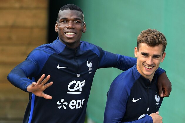 France's midfielder Paul Pogba (L) and France's forward Antoine Griezmann react at the end of a training session in Neustift im Stubaital, on June 1, 2016, as part of the team's preparation for the upcoming Euro 2016 European football championships.  / AFP / FRANCK FIFE        (Photo credit should read FRANCK FIFE/AFP/Getty Images)