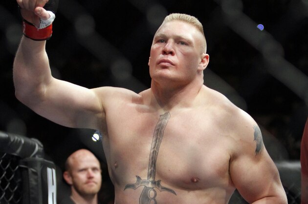 Brock Lesnar enters the ring just before his UFC heavyweight mixed martial arts match against Alistair Overeem of the Netherlands, Friday, Dec. 30, 2011 at The MGM Grand Garden Arena in Las Vegas. Overeem won by first round TKO and Lesnar announced his retirement after the fight. (AP Photo/Eric Jamison)