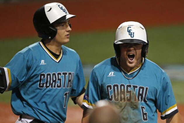 Coastal Carolina's Connor Owings (6) reacts with Billy Cooke after scoring on an RBI single off the bat of G.K. Young in the first inning of an NCAA college baseball tournament super regional game against LSU in Baton Rouge, La., Sunday, June 12, 2016. (AP Photo/Gerald Herbert)