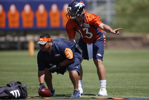 Denver Broncos quarterback Trevor Siemian (13) during an NFL football practice at the team's headquarters Wednesday, June 8, 2016, in Englewood, Colo. (AP Photo/David Zalubowski)