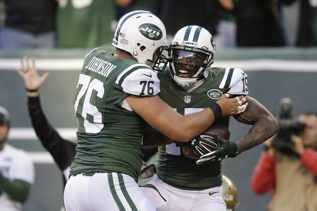 New York Jets wide receiver Brandon Marshall (15) celebrates with New York Jets center Wesley Johnson (76) after scoring a touchdown against Jacksonville Jaguars during the fourth quarter of an NFL football game, Sunday, Nov. 8, 2015, in East Rutherford, N.J. (AP Photo/Seth Wenig)