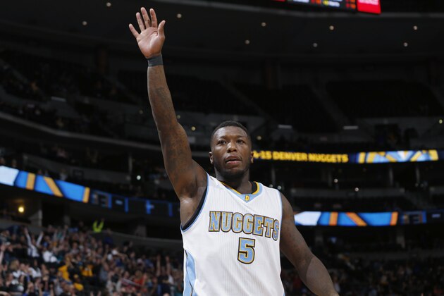 Denver Nuggets guard Nate Robinson celebrates as time runs down in the Nuggets' NBA basketball game against the Orlando Magic on Wednesday, Jan. 7, 2015, in Denver. The Nuggets won 93-90. (AP Photo/David Zalubowski)