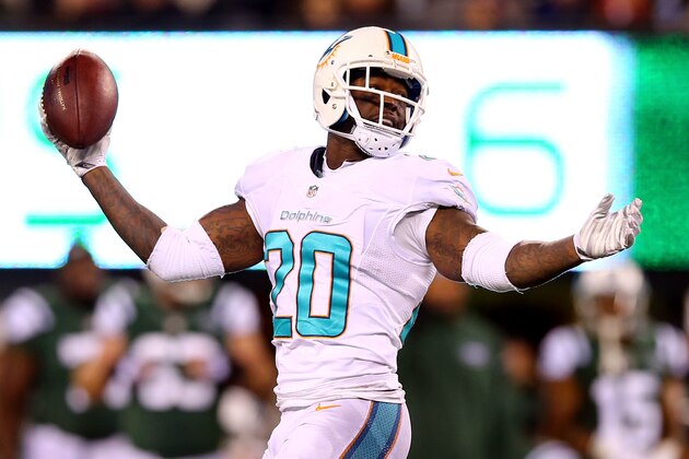 EAST RUTHERFORD, NJ - DECEMBER 01:   Reshad Jones #20 of the Miami Dolphins reacts against the New York Jets during their game at MetLife Stadium on December 1, 2014 in East Rutherford, New Jersey.  (Photo by Elsa/Getty Images)