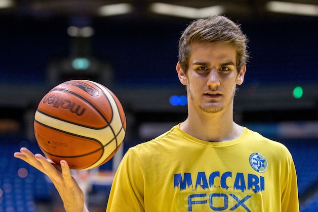 Dragan Bender, a professional Croatian basketball player currently playing for Maccabi Tel Aviv in the Israeli Basketball Super League poses for a photo after a training session at the Menora Mivtachim Arena in Tel Aviv on March 16, 2016.
Bender's name is not yet well known beyond hardcore basketball fans, but that may soon change. Bender is expected to be highly sought after by US professional basketball teams in the coming months.
 / AFP / JACK GUEZ        (Photo credit should read JACK GUEZ/AFP/Getty Images)