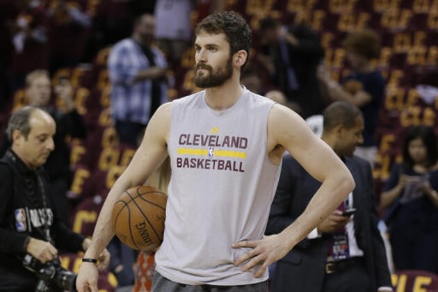 Cleveland Cavaliers forward Kevin Love pauses as players warm up for Game 4 of basketball's NBA Finals between the Cavaliers and the Golden State Warriors in Cleveland, Friday, June 10, 2016. (AP Photo/Tony Dejak)