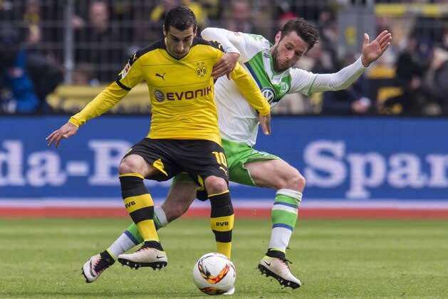 (L-R) Henrikh Mkhitaryan of Borussia Dortmund, Christian Trï¿½ï¿½sch of VFL Wolfsburg during the Bundesliga match between Borussia Dortmund and VfL Wolfsburg on April 30, 2016 at the Signal Idun Park stadium in Dortmund, Germany.(Photo by VI Images via Getty Images)