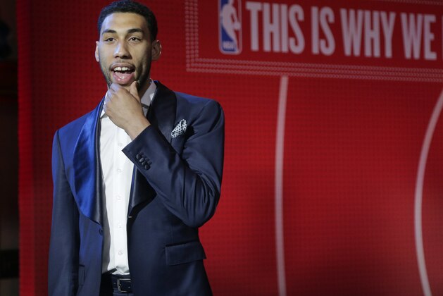 Top draft prospect Denzel Valentine finishes an interview before the start of the NBA basketball draft lottery, Tuesday, May 17, 2016, in New York. (AP Photo/Julie Jacobson)