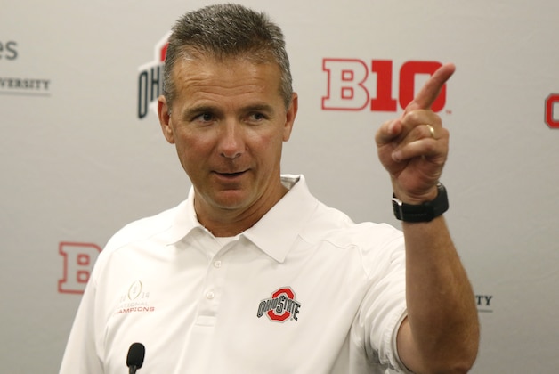 FILE - In this Aug. 16, 2015, file photo, Ohio State coach Urban Meyer speaks to reporters during the university's NCAA college football media day in Columbus, Ohio. Ohio State is the first unanimous preseason No. 1 in The Associated Press college football poll. (AP Photo/Paul Vernon, File)