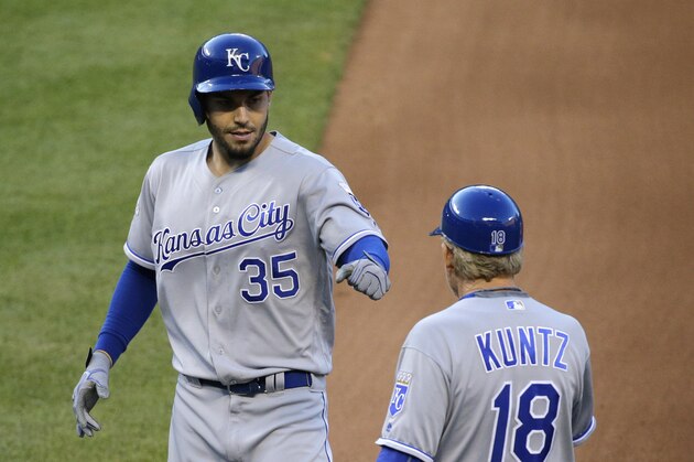 Kansas City Royals' Eric Hosmer, left, fist bumps first base coach Rusty Kuntz after hitting a single during a baseball game against the Baltimore Orioles in Baltimore, Wednesday, June 8, 2016. (AP Photo/Patrick Semansky)