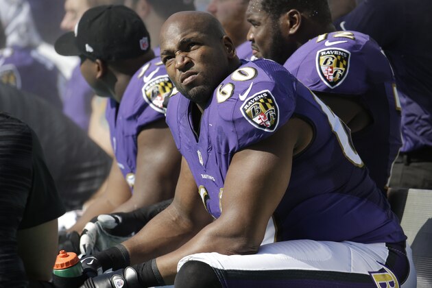 Baltimore Ravens tackle Eugene Monroe (60) looks up from the sidelines during the first half of an NFL football game against the Miami Dolphins, Sunday, Dec. 7, 2014, in Miami Gardens, Fla. (AP Photo/Lynne Sladky)