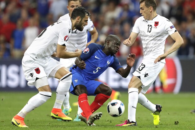 France's N'Golo Kante center, is challenged by Albania's Lorik Cana, left, and Albania's Burim Kukeli during the Euro 2016 Group A soccer match between France and Albania at the Velodrome stadium in Marseille, France, Wednesday, June 15, 2016. (AP Photo/Ariel Schalit)