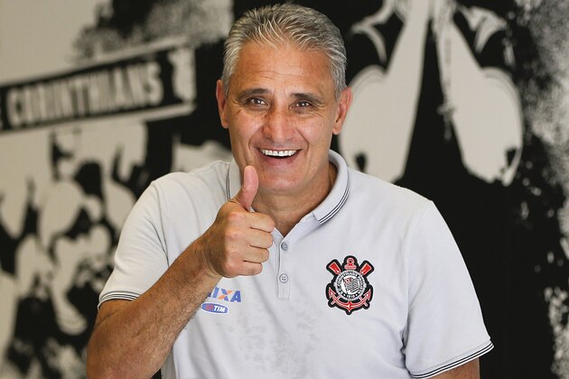 FILE - In this Dec. 5, 2015 file photo, Corinthians soccer coach Adenor Leonardo Bacchi, known as Tite, flashes a thumbs up as he poses after a team training session at the Itaquerao stadium, in Sao Paulo, Brazil. On Wednesday, June 15, 2016, the president of the Corinthians football club announced that Tite, has been named the new coach of Brazil's national team. (AP Photo/Andre Penner, File)