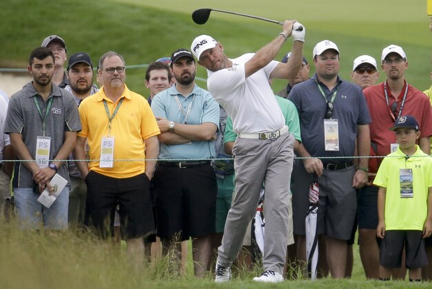 Lee Westwood, of England, watches his tee shot on the 14th hole during the first round of the U.S. Open golf championship at Oakmont Country Club on Thursday, June 16, 2016, in Oakmont, Pa. (AP Photo/John Minchillo)