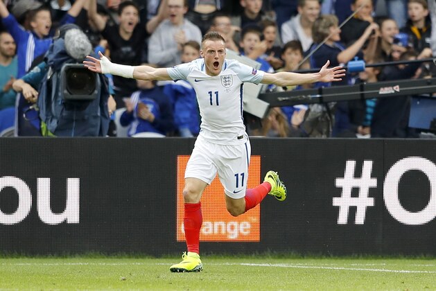 England's Jamie Vardy celebrates after scoring his side's first goal during the Euro 2016 Group B soccer match between England and Wales at the Bollaert stadium in Lens, France, Thursday, June 16, 2016. (AP Photo/Frank Augstein)