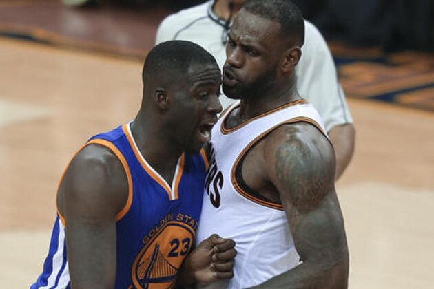 Golden State Warriors forward Draymond Green (23) and Cleveland Cavaliers forward LeBron James (23) have words during the second half of Game 4 of basketball's NBA Finals in Cleveland, Friday, June 10, 2016. The Warriors won 108-97. (AP Photo/Ron Schwane)