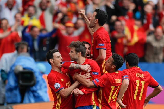Spain players celebrate after Gerard Pique, 2nd left, scored the opening goal during the Euro 2016 Group D soccer match between Spain and the Czech Republic at the Stadium municipal in Toulouse, France, Monday, June 13, 2016. (AP Photo/Manu Fernandez)