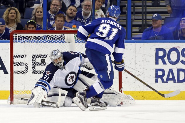Tampa Bay Lightning's Steven Stamkos scores past Winnipeg Jets' Ondrej Pavelec, of the Czech Republic, during the shootout of an NHL hockey game Thursday, Feb. 18, 2016, in Tampa, Fla. The Lightning won 6-5. (AP Photo/Mike Carlson)