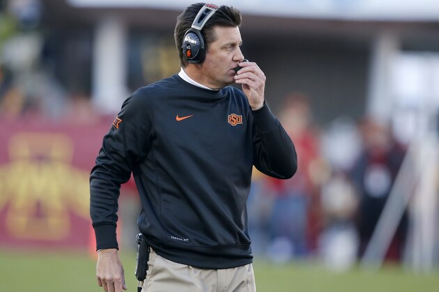 AMES, IA - NOVEMBER 14: Head coach Mike Gundy of the Oklahoma State Cowboys coaches from the sidelines in the first half of play against the Iowa State Cyclones at Jack Trice Stadium on November 14, 2015 in Ames, Iowa. The Oklahoma State Cowboys defeated Iowa State 35-31.(Photo by David K Purdy/Getty Images)