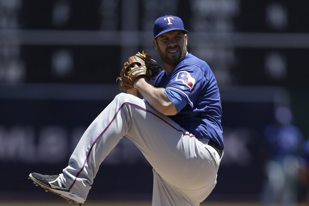 Texas Rangers pitcher Colby Lewis works against the Oakland Athletics in the first inning of a baseball game Thursday, June 16, 2016, in Oakland, Calif. (AP Photo/Ben Margot)