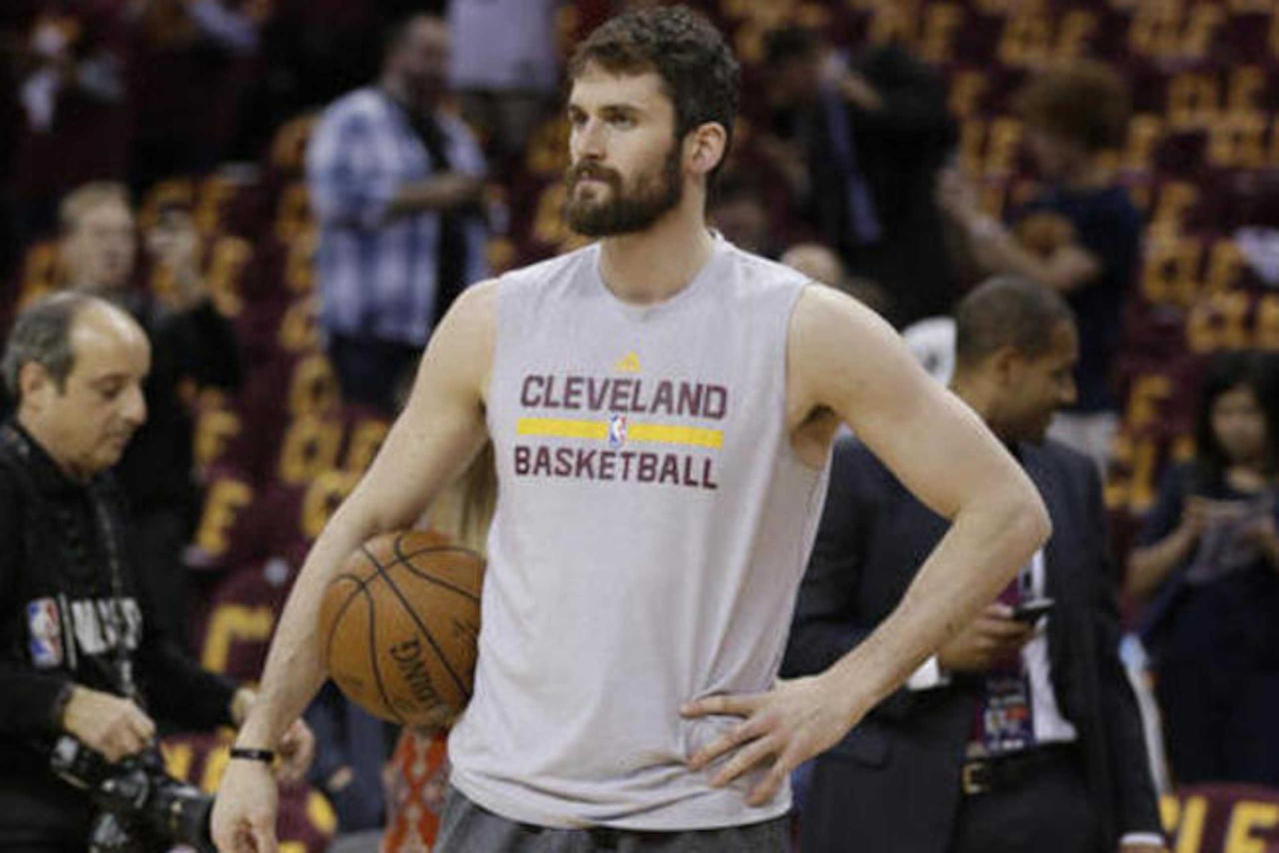 Cleveland Cavaliers forward Kevin Love pauses as players warm up for Game 4 of basketball's NBA Finals between the Cavaliers and the Golden State Warriors in Cleveland, Friday, June 10, 2016. (AP Photo/Tony Dejak)