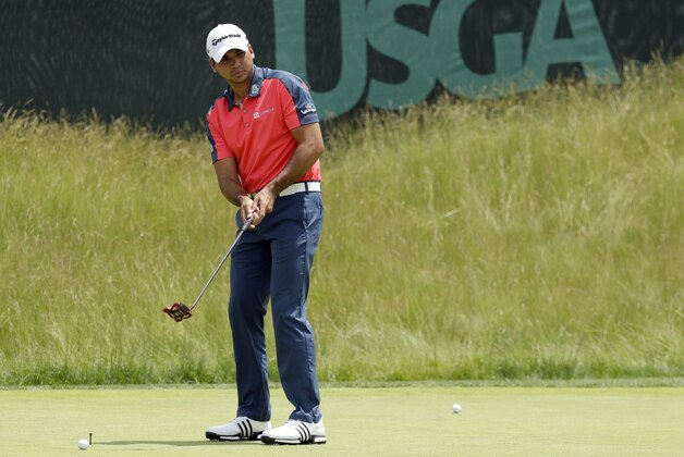 Jason Day, of Australia, watches his putt on the practice green at the U.S. Open golf championship at Oakmont Country Club on Wednesday, June 15, 2016, in Oakmont, Pa. (AP Photo/Charlie Riedel)
