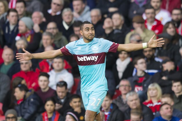 West Ham United's Dimitri Payet celebrates after scoring during the English FA Cup quarterfinal soccer match between Manchester United and West Ham United at Old Trafford Stadium, Manchester, England, Sunday March 13, 2016. (AP Photo/Jon Super)
