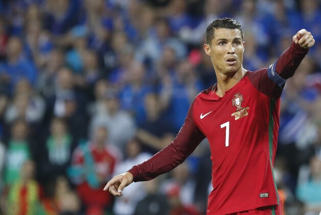 Portugal's Cristiano Ronaldo reacts  during the Euro 2016 Group F soccer match between Portugal and Iceland at the Geoffroy Guichard stadium in Saint-Etienne, France, Tuesday, June 14, 2016. (AP Photo/Laurent Cipriani)