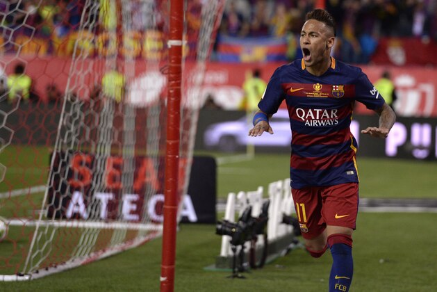 Barcelona's Brazilian forward Neymar celebrates a goal during the Spanish 'Copa del Rey' (King's Cup) final match FC Barcelona vs Sevilla FC at the Vicente Calderon stadium in Madrid on May 22, 2016. / AFP / JOSEP LAGO        (Photo credit should read JOSEP LAGO/AFP/Getty Images)
